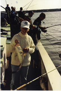 Here is Tina's large 4 kg cod. I stand with a sea trout caught on a green pirk on the image behind.