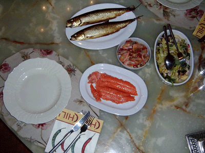 Two delicious home-smoked herring. This is what a good smoke looks like against a blue sky