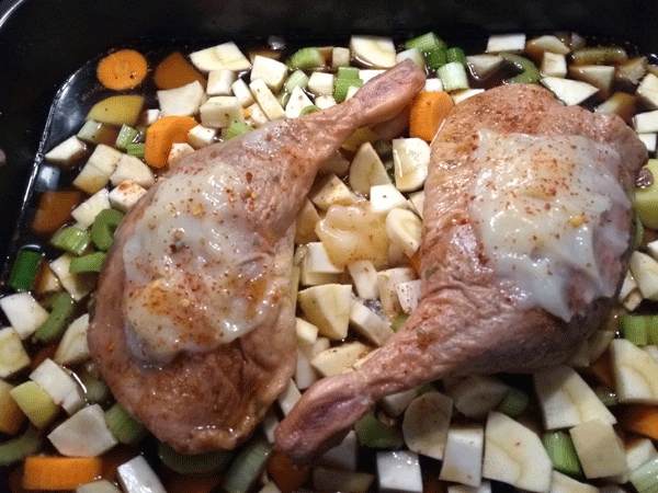 Smoked duck leg on a base of root vegetables