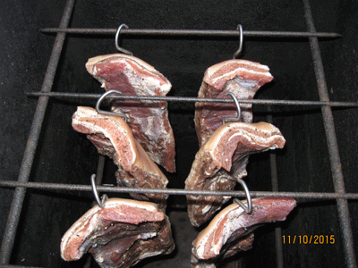 Ribs are hung in the smoke oven