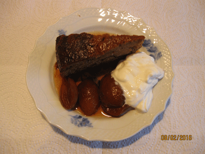 Fishing carrot cake garnished with Creme Fraiche and plums in Madeira